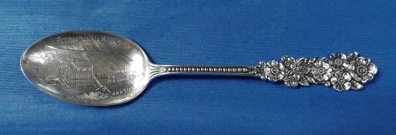 Souvenir Mining Spoon Standard Mine.jpg - SOUVENIR MINING SPOON STANDARD MINE MACE ID - Sterling silver spoon, 5 1/4 in. long, engraved mining scene in bowl, bowl marked STANDARD MINE, MACE IDA, handle front has floral decoration with dots down to the bowl, reverse is marked Sterling and maker’s mark of Codding Bros. & Heilbor company (C.B. & H, North Attleboro, MA. 1879-1918) [Opened in 1892, the Standard Mine was one of the more prosperous silver mines in Burke Valley near Mace, Idaho between the towns of Wallace and Burke in Shoshone County.  Like all towns in Burke Valley, Mace was subject to natural disasters.  The worst disaster was the avalanche of February 27, 1910, which destroyed the mine and most of the town.  Killing at least 20 people and injuring hundreds, Mace was left in ruins.  However the mine was a good producer so it was rebuilt along with Mace and continued operation for several more years.  Today, nothing is left of Mace.]